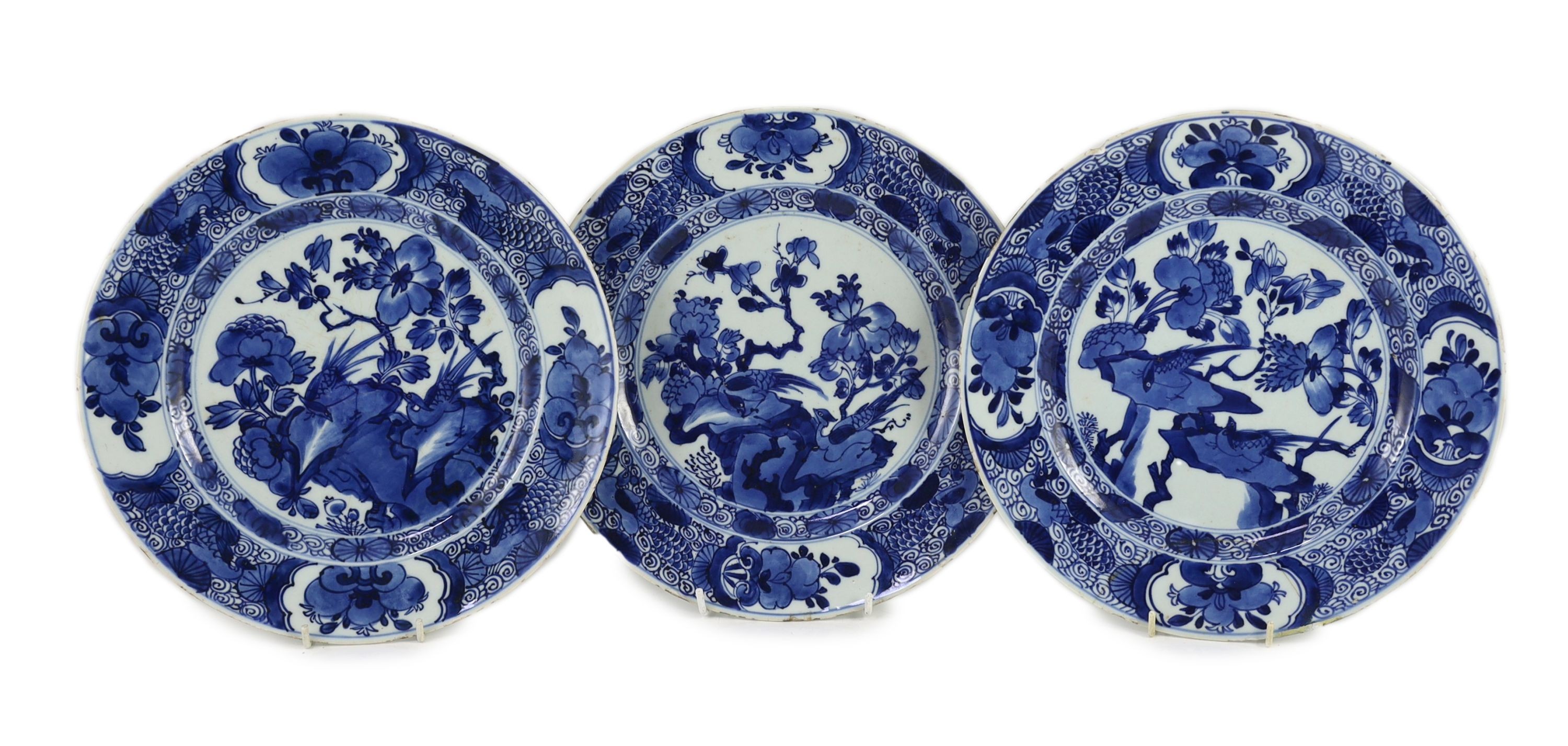 A set of three Chinese blue and white ‘pheasant’ large plates, Kangxi period, 28cm diameter, one repaired